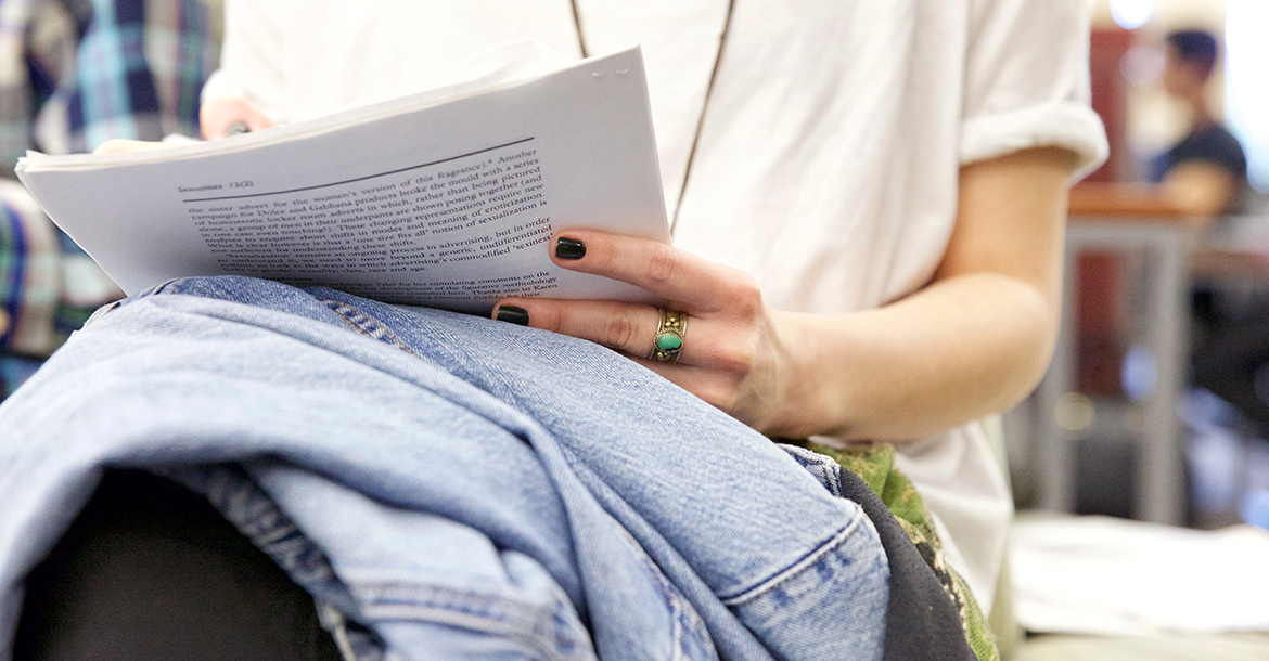 student holding an article