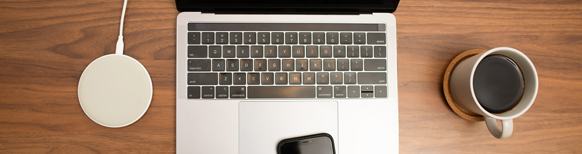 computer and coffee on a desk