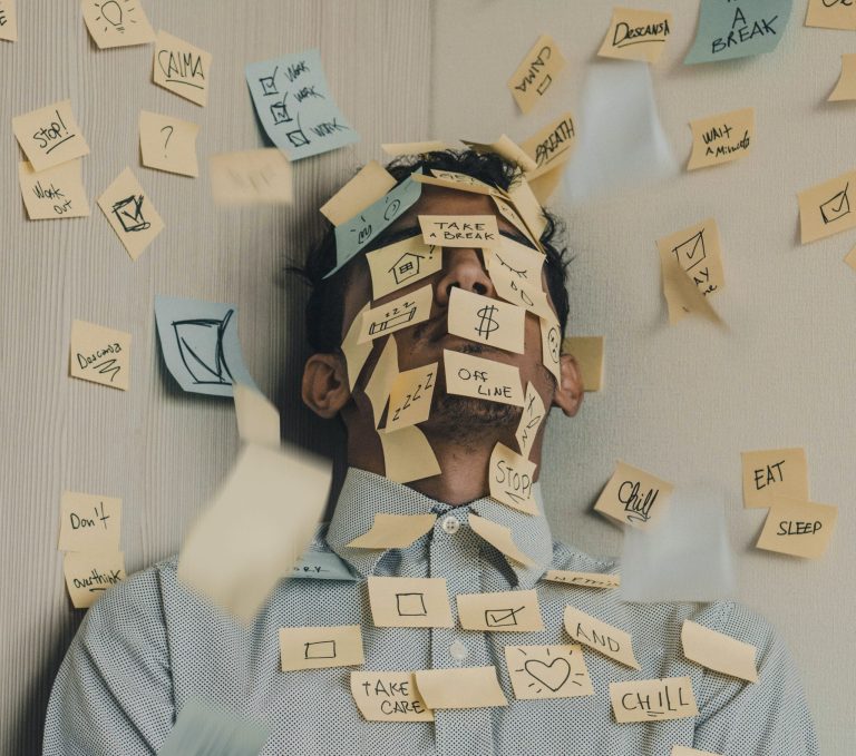 Man with sticky notes all over his face