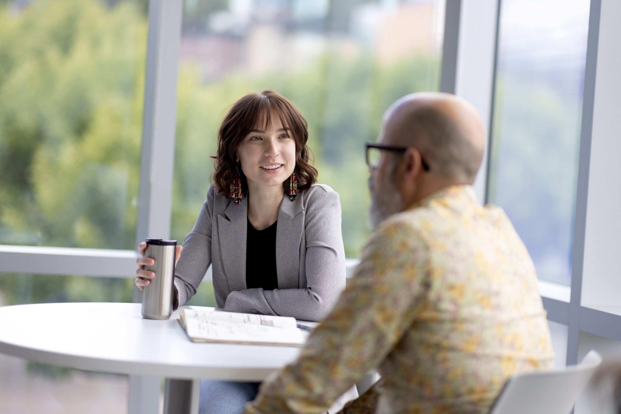 Student and mentor having coffee 